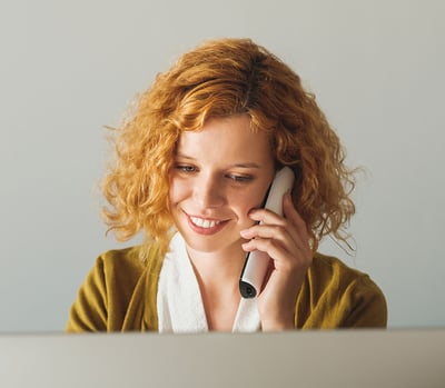 Businesswoman Speaking On The Phone At The Office  Businesswoman Speaking On The Phone At The Office