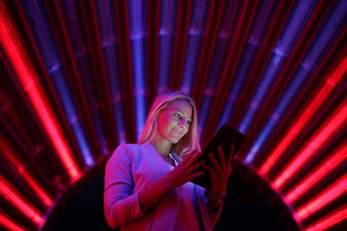 Businesswoman with tablet pc against high tech lights background Businesswoman with tablet pc against high tech lights background
