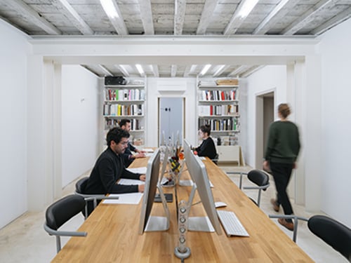 Startup Office Woman walking in a modern office space.