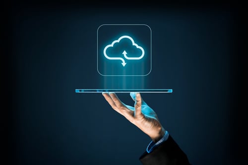 Hand holding tablet with cloud icon above it hand holding tablet, with cloud computing icon above it