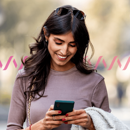 Own Your Brand infographic thumbnail Photo of a woman looking at a mobile phone and smiling